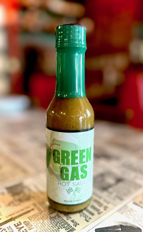 Green Gas Bottle on table at Gay Nineties Pizza.